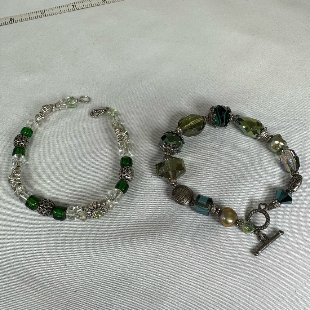 Two green tone bracelets